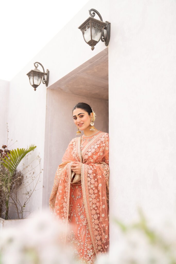 Hina Afridi in an embroidered peach outfit, editorial portrait